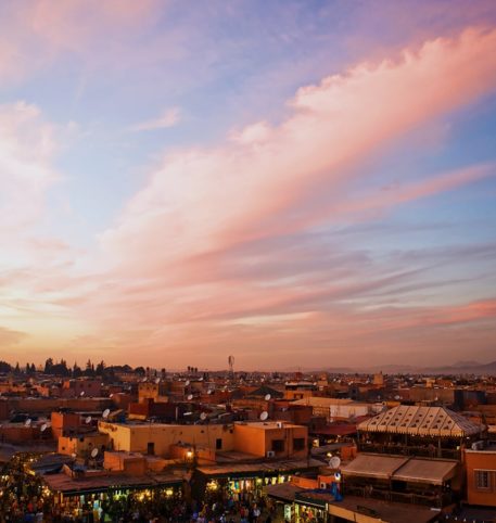 Panoramic view of a city in Morocco at dusk. Big South Kasbahs Morocco holidays.