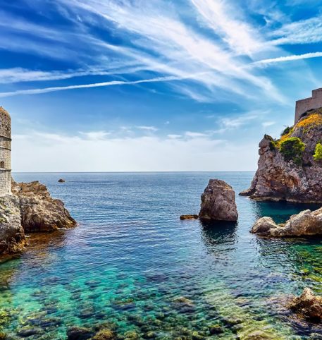 Old castle by the sea and impressive rocks. Discovery of Croatia holidays package.