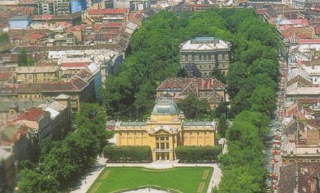 Panoramic view of a beautiful square with imposing buildings and trees in Zagreb.