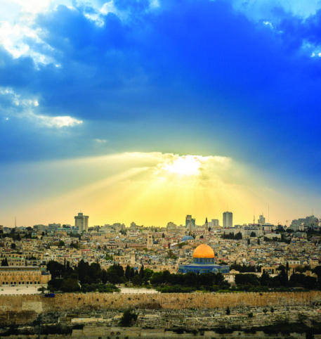 Solar rays in the sky of Jerusalem. Panoramic view of the city, one of the most popular destinations